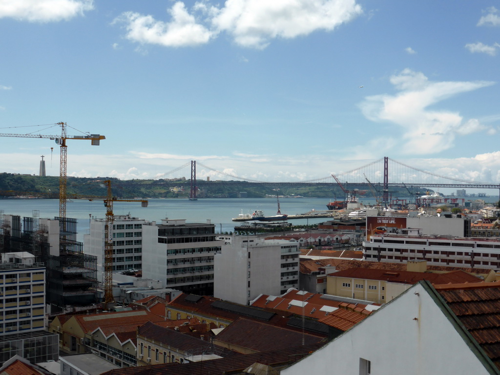 The Ponte 25 de Abril bridge over the Rio Tejo river and the Cristo Rei statue, viewed from the Miradouro da Santa Catarina viewpoint
