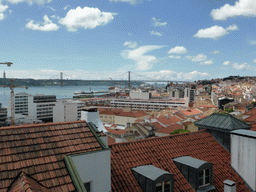 The Ponte 25 de Abril bridge over the Rio Tejo river and the Cristo Rei statue, viewed from the Miradouro da Santa Catarina viewpoint