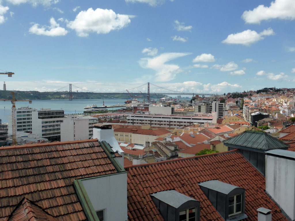 The Ponte 25 de Abril bridge over the Rio Tejo river and the Cristo Rei statue, viewed from the Miradouro da Santa Catarina viewpoint