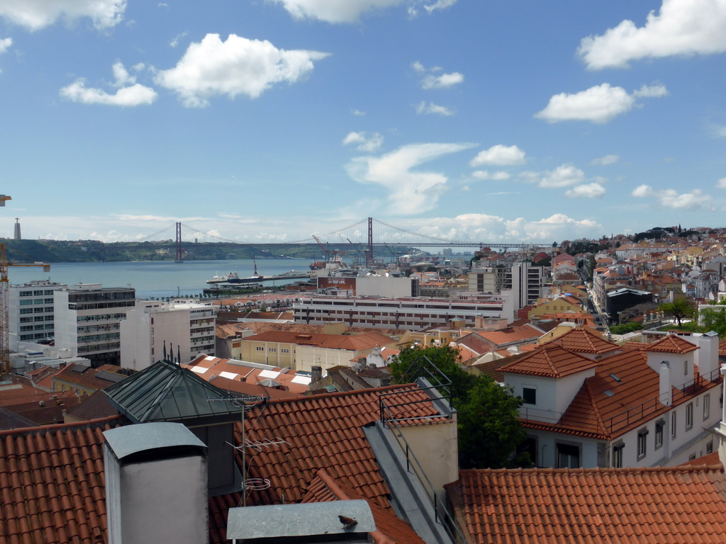 The Ponte 25 de Abril bridge over the Rio Tejo river and the Cristo Rei statue, viewed from the Miradouro da Santa Catarina viewpoint