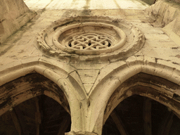 Window and arches in a wall at the Cloister of the Lisbon Cathedral