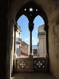 Window at the Cloister of the Lisbon Cathedral, with a view on the south side of the city and the Rio Tejo river