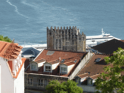 The towers of the Lisbon Cathedral at the south side of the city and the Rio Tejo river, viewed from the Praça d`Armas square at the São Jorge Castle