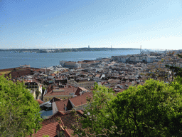 The southwest side of the city with the Ponte 25 de Abril bridge over the Rio Tejo river and the Cristo Rei statue, viewed from the Praça d`Armas square at the São Jorge Castle