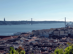 The southwest side of the city with the Ponte 25 de Abril bridge over the Rio Tejo river and the Cristo Rei statue, viewed from the Praça d`Armas square at the São Jorge Castle