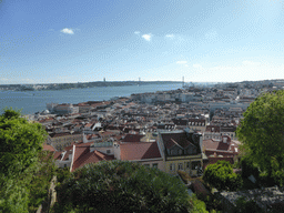 The southwest side of the city with the Ponte 25 de Abril bridge over the Rio Tejo river and the Cristo Rei statue, viewed from the Praça d`Armas square at the São Jorge Castle