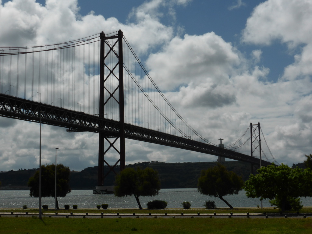 The Ponte 25 de Abril bridge over the Rio Tejo river and the Cristo Rei statue, viewed from the sightseeing bus