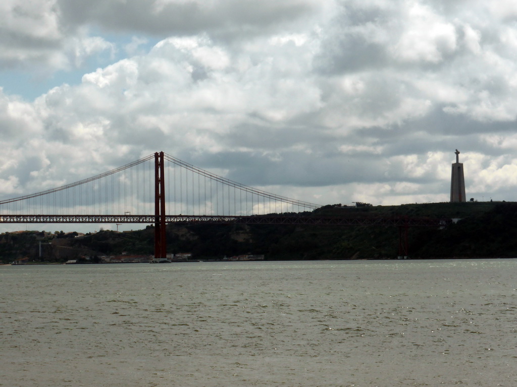 The Ponte 25 de Abril bridge over the Rio Tejo river and the Cristo Rei statue