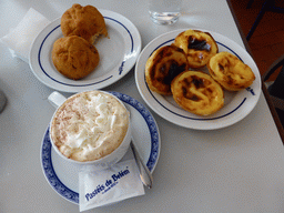 Pastries and coffee at the Pastéis de Belém restaurant at the Rua Belém street