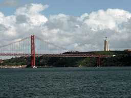 The Ponte 25 de Abril bridge over the Rio Tejo river and the Cristo Rei statue