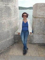Miaomiao at the platform on the first floor of the Torre de Belém tower, with a view on the Rio Tejo river