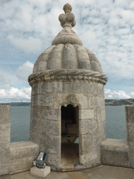 Watchtower at the platform on the first floor of the Torre de Belém tower, with a view on the Rio Tejo river and the Cristo Rei statue