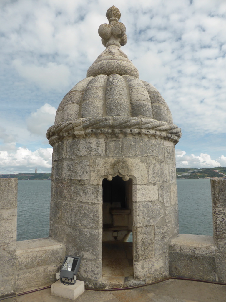 Watchtower at the platform on the first floor of the Torre de Belém tower, with a view on the Rio Tejo river and the Cristo Rei statue