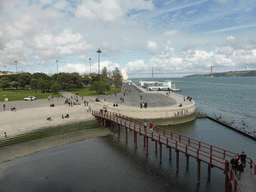 The coastline on the east side with the Padrão dos Descobrimentos monument, the Ponte 25 de Abril bridge over the Rio Tejo river and the Cristo Rei statue, viewed from the first floor of the Torre de Belém tower