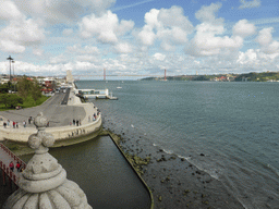 The coastline on the east side with the Padrão dos Descobrimentos monument, the Ponte 25 de Abril bridge over the Rio Tejo river and the Cristo Rei statue, viewed from the Loggia at the second floor of the Torre de Belém tower