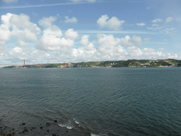 The Ponte 25 de Abril bridge over the Rio Tejo river and the Cristo Rei statue, viewed from the Loggia at the second floor of the Torre de Belém tower