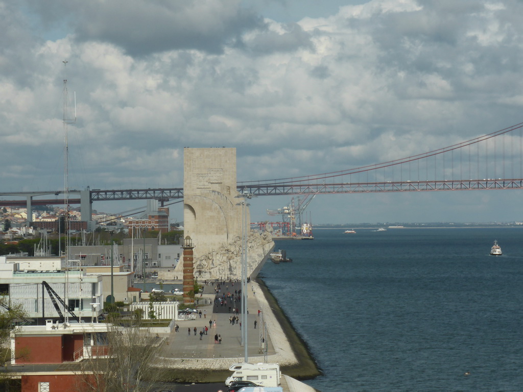 The coastline on the east side with the Padrão dos Descobrimentos monument and the Ponte 25 de Abril bridge over the Rio Tejo river, viewed from the fourth floor of the Torre de Belém tower