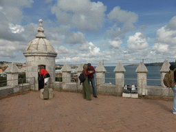 The top of the Torre de Belém tower, with a view on the Ponte 25 de Abril bridge over the Rio Tejo river