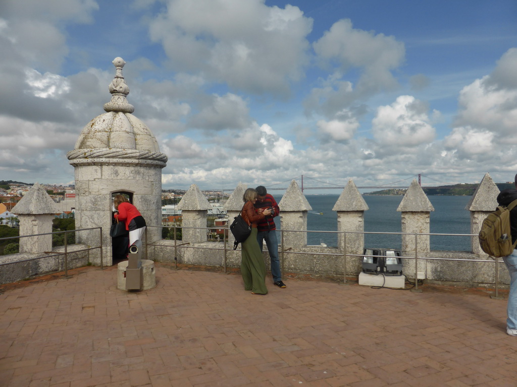 The top of the Torre de Belém tower, with a view on the Ponte 25 de Abril bridge over the Rio Tejo river