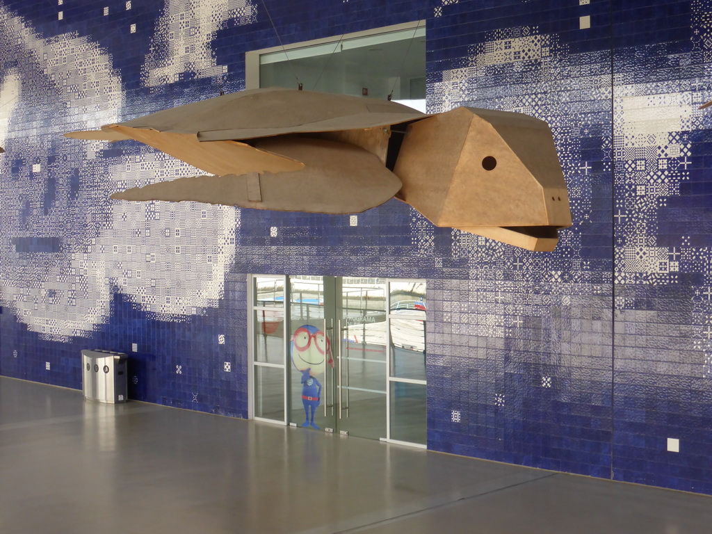 Wooden model of a sea turtle hanging over the main walkway at the Lisbon Oceanarium