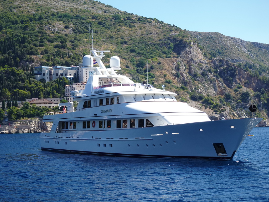 Boat `Constance` in front of Hotel Belvedere at the east side of Dubrovnik, viewed from the ferry from Dubrovnik Harbour