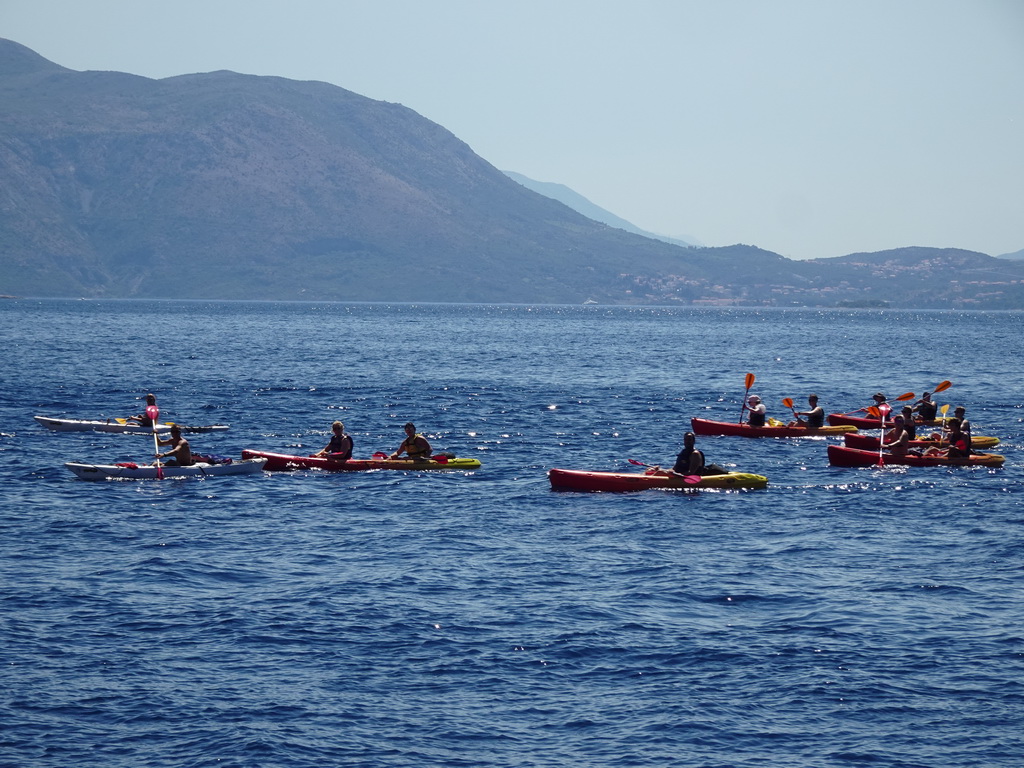 Canoes in front of the east side of Dubrovnik, viewed from the ferry from Dubrovnik Harbour
