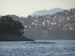 Canoes in front of the east side of Lokrum Island and the Old Town of Dubrovnik, viewed from the ferry to Dubrovnik Harbour