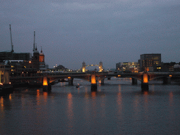 The Southwark Bridge and the Tower Bridge over the Thames river, from the Millennium Bridge, by night
