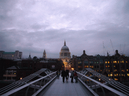 The Millennium Bridge and the dome of St. Paul`s Cathedral, by night