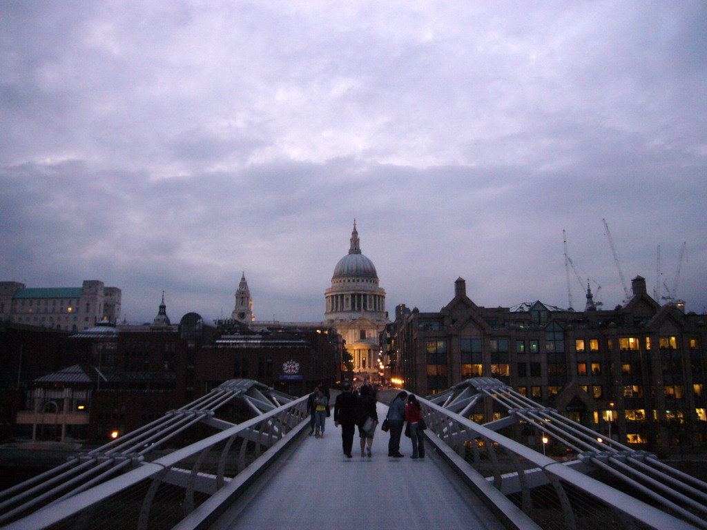 The Millennium Bridge and the dome of St. Paul`s Cathedral, by night