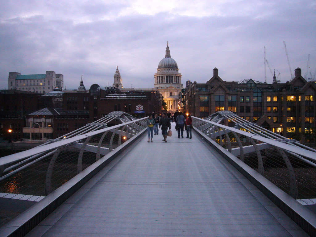 The Millennium Bridge and the dome of St. Paul`s Cathedral, by night