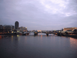 The Blackfriars Railway Bridge over the Thames river, from the Millennium Bridge, by night