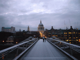 The Millennium Bridge and the dome of St. Paul`s Cathedral, by night