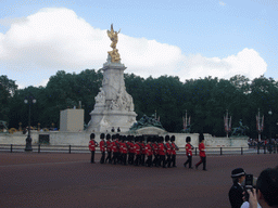 Changing of the Guard at Buckingham Palace, in front of the Victoria Memorial