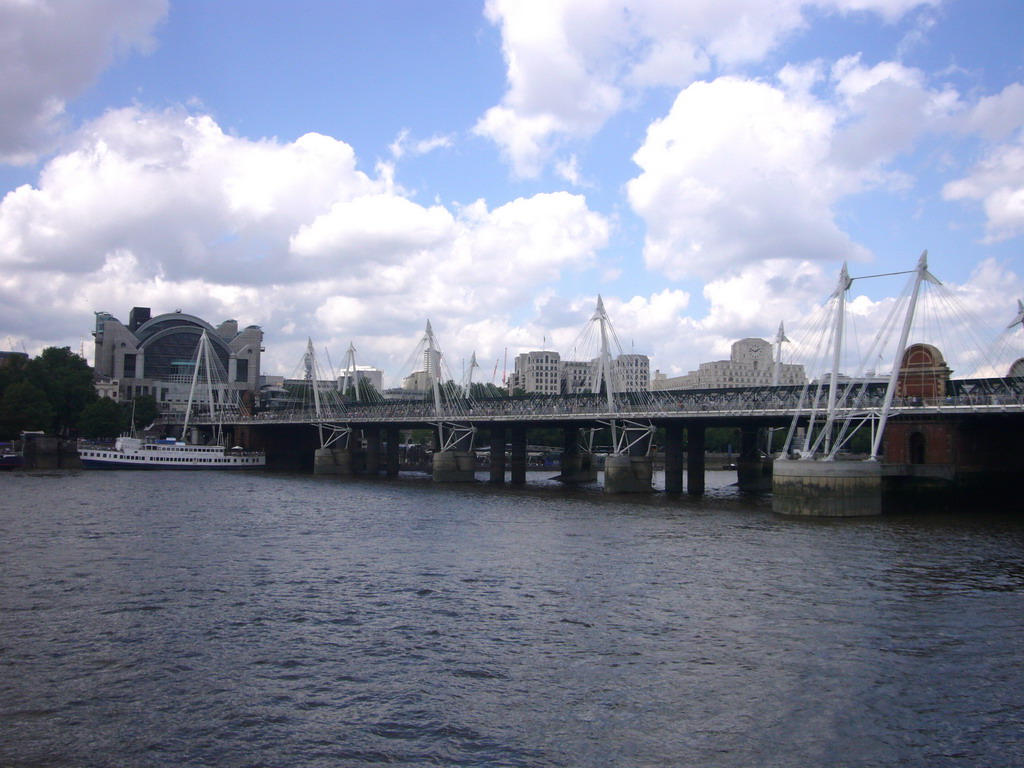 The Hungerford Bridge over the Thames river, and Charing Cross railway station