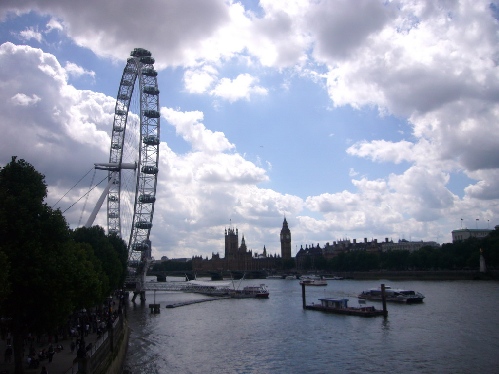 The London Eye, the Waterloo Millennium Pier, the Westminster Bridge over the Thames river and the Palace of Westminster with the Big Ben, from the Hungerford Bridge