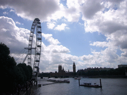 The London Eye, the Waterloo Millennium Pier, the Westminster Bridge over the Thames river and the Palace of Westminster with the Big Ben, from the Hungerford Bridge