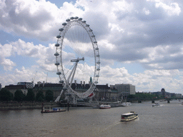 The London Eye, the Waterloo Millennium Pier and the Westminster Bridge over the Thames river, from the Hungerford Bridge