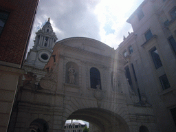 Gate between Paternoster Square and St. Paul`s Church Yard, and one of the towers of St. Paul`s Cathedral