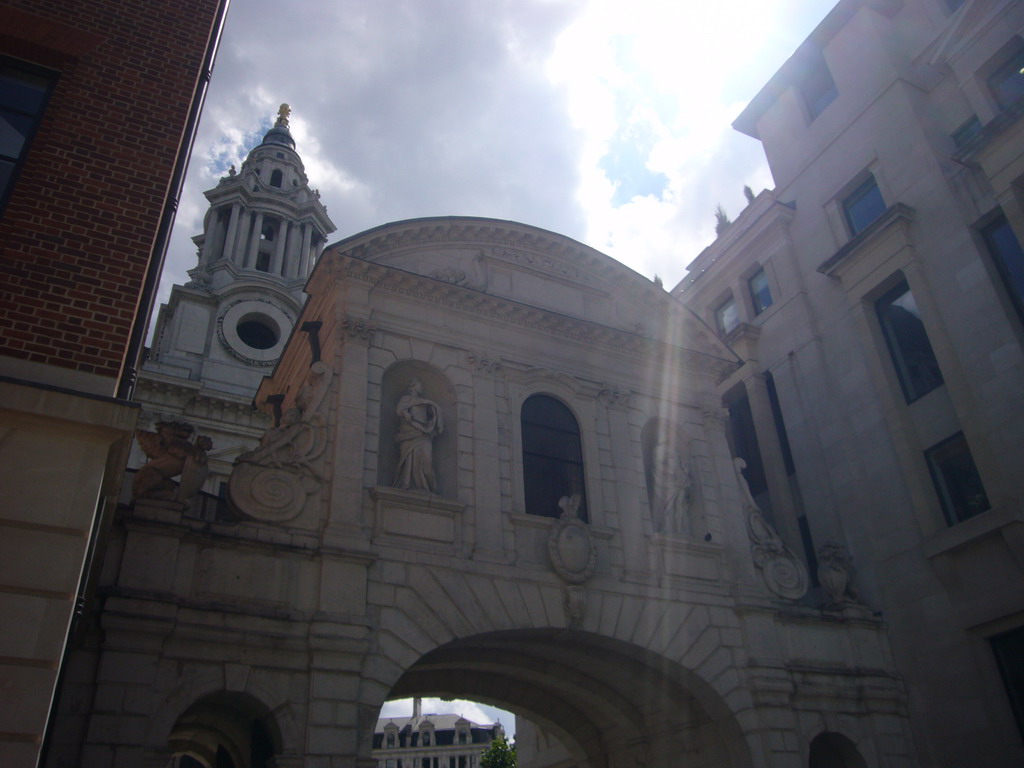 Gate between Paternoster Square and St. Paul`s Church Yard, and one of the towers of St. Paul`s Cathedral