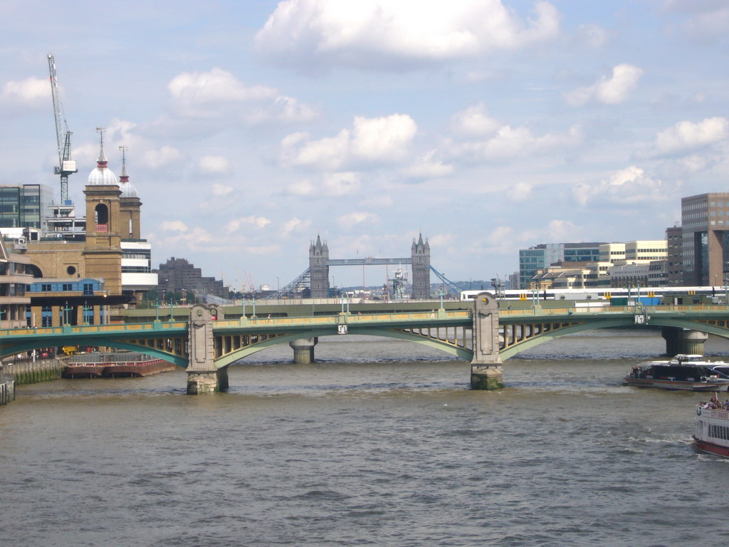 Cannon Street Station, the Southwark Bridge and the Tower Bridge over the Thames river, from the Millennium Bridge