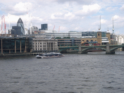 Cannon Street Station, 30 St. Mary Axe and the Southwark Bridge over the Thames river, from the Millennium Bridge