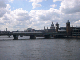 The Cannon Street Railway Bridge over the Thames river, the Cannon Street Station and St. Paul`s Cathedral, from London Bridge
