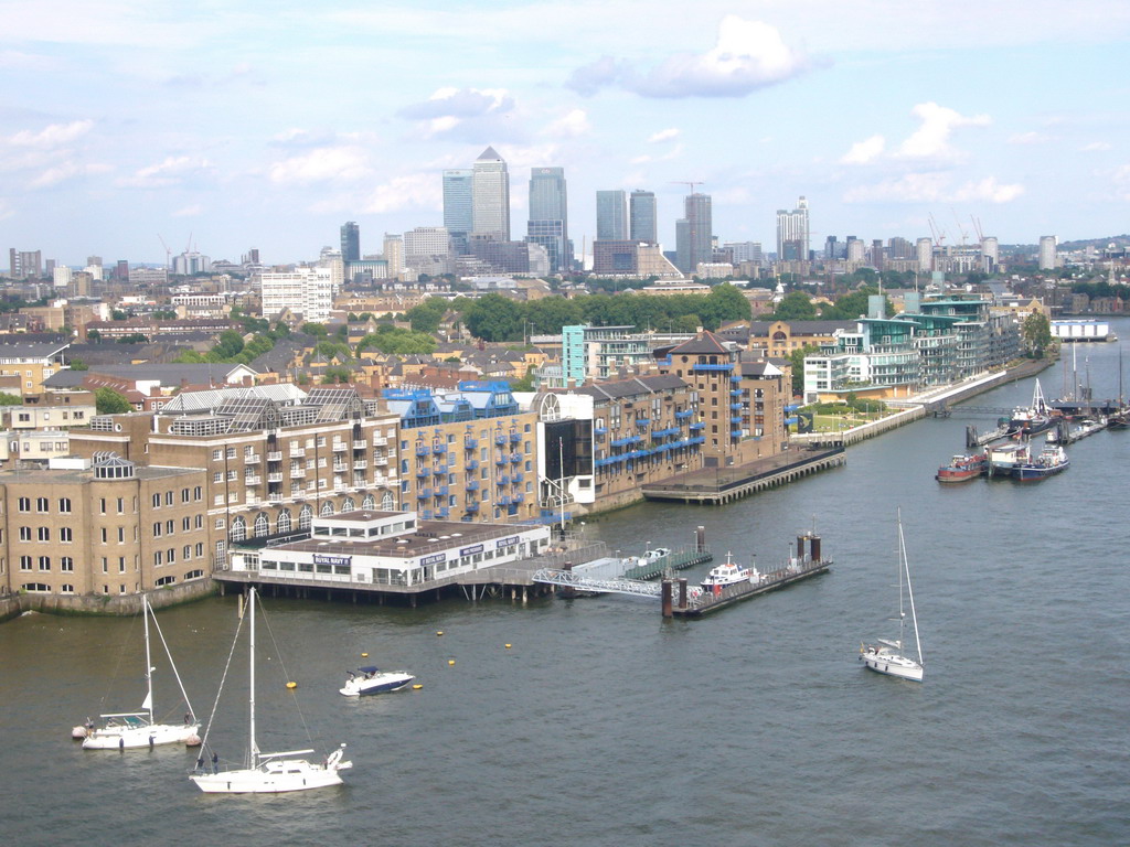 The Thames river and Canary Wharf, viewed from the east high level walkway of the Tower Bridge