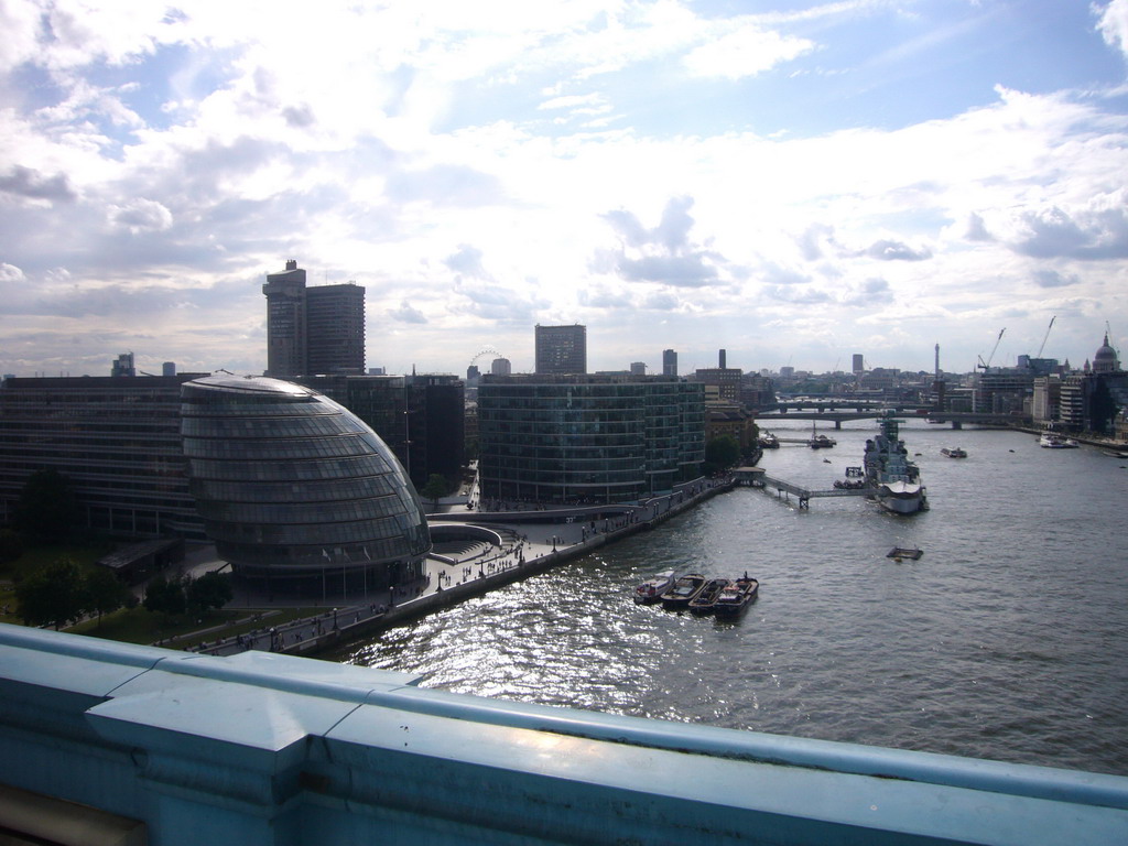 The Thames river, the City Hall, the London Eye, the London Bridge City Pier, the HMS Belfast ship, the London Bridge, the Cannon Street Railway Bridge and St. Paul`s Catehdral, viewed from the west high level walkway of the Tower Bridge