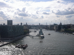 The Thames river, the London Eye, the London Bridge City Pier, the HMS Belfast ship, the London Bridge, the Cannon Street Railway Bridge and St. Paul`s Catehdral, viewed from the west high level walkway of the Tower Bridge