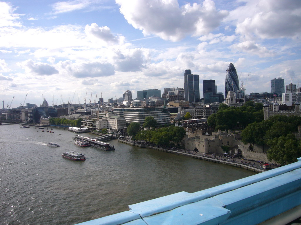 The Thames river, the Tower of London, 30 St. Mary Axe, Ten Trinity Square and St. Paul`s Cathedral, viewed from the west high level walkway of the Tower Bridge