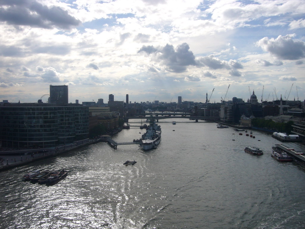 The Thames river, the London Eye, the London Bridge City Pier, the HMS Belfast ship, the London Bridge, the Cannon Street Railway Bridge and St. Paul`s Catehdral, viewed from the west high level walkway of the Tower Bridge