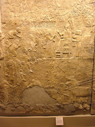 Assyrian carved stone panel, in the British Museum