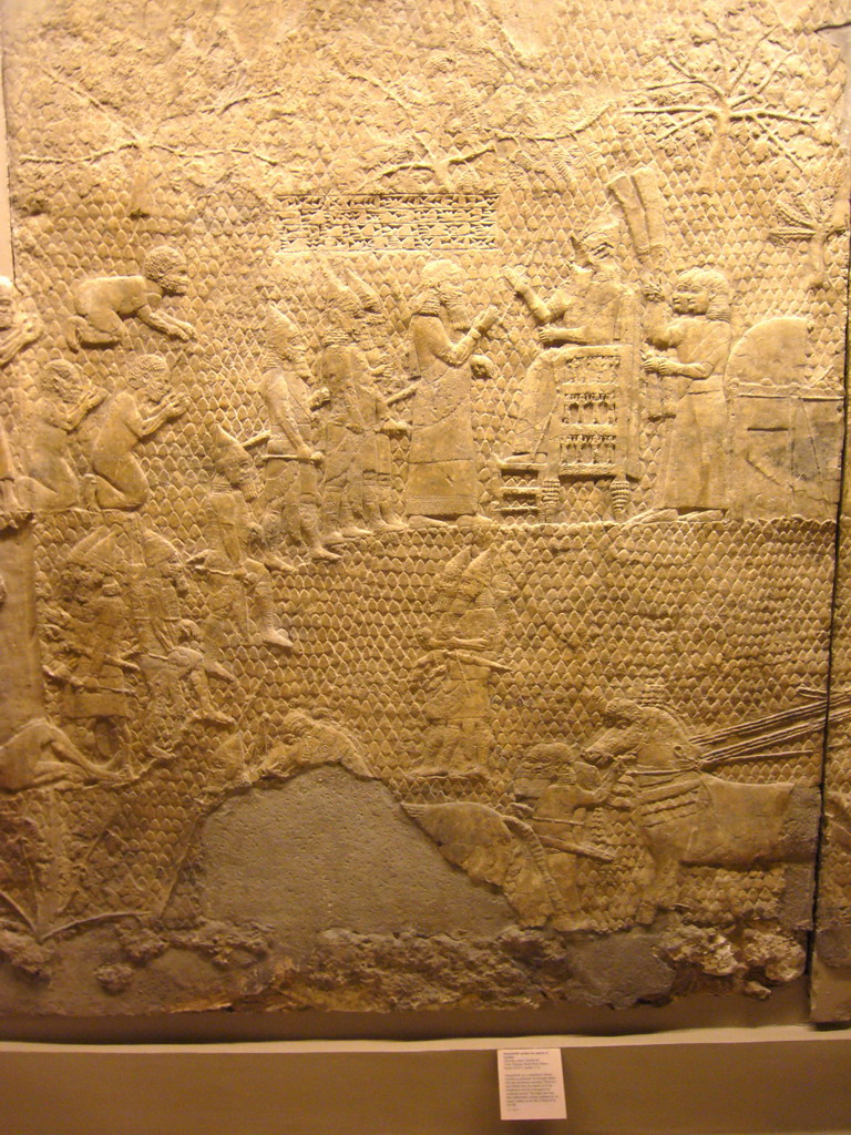 Assyrian carved stone panel, in the British Museum